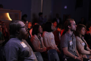 A captive audience attentively takes in the lecture by Stone.