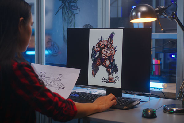 A digital artist creating and studying concept art in the studio.