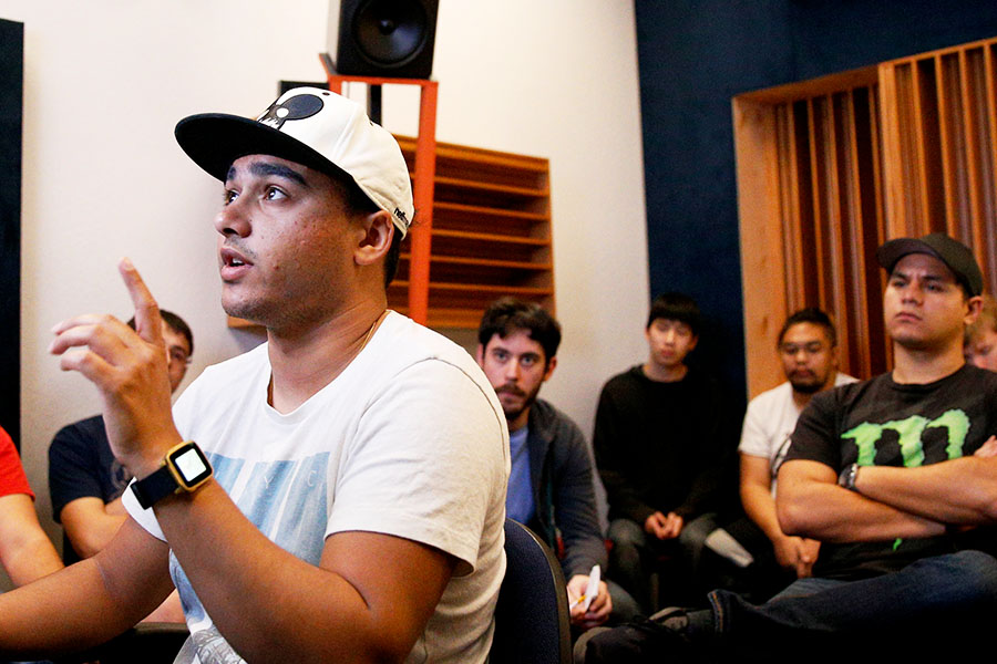 A USV Audio Recording instructor demonstrating his lesson in front of a classroom.