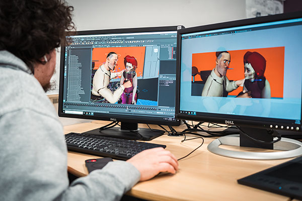 USV Digital Art & Animation student animating 3D characters in the classroom.