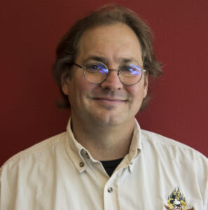 Headshot of USV Faculty Member, Christopher Kelly