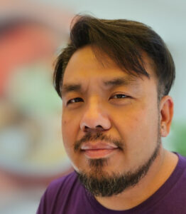 Headshot of USV Faculty Member, Kong Vang