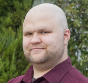 Headshot of USV Faculty Member, Nathan Oliver
